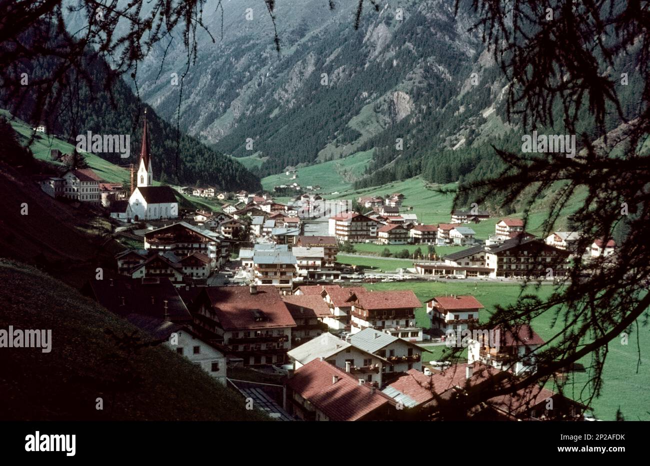 View of Sölden with the parish church from a hiking trail. Sölden, Oetztal, Imst, Tyrol, Austria, 1971/1972 Stock Photo