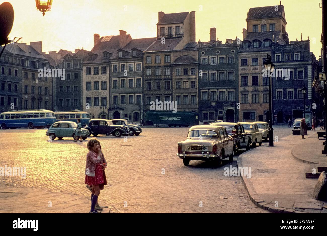 Two children standing on the Old Town Market Place, historic centre of Warsaw, Capital City of Warsaw, Masovian Voivodeship, Poland, 1962 Stock Photo