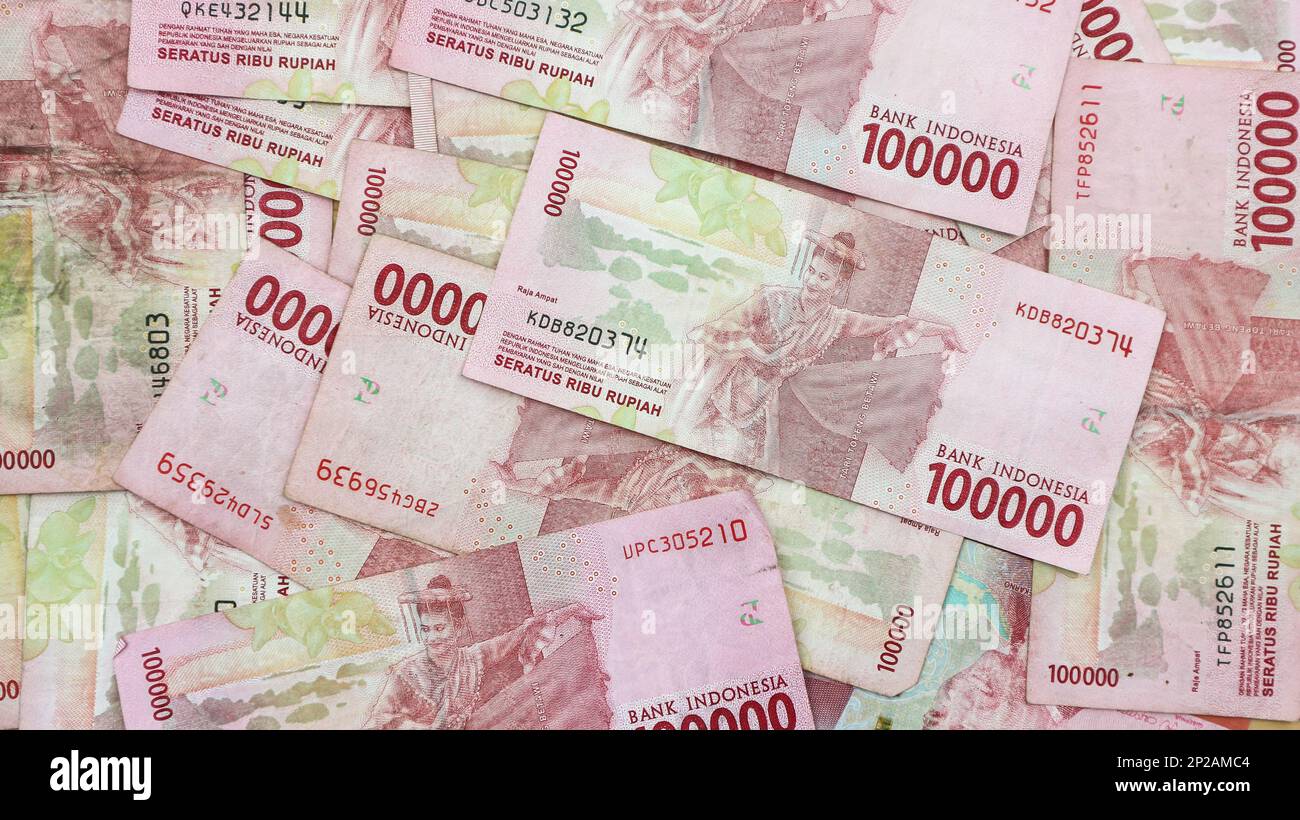 A pile of Indonesian thousand rupiah notes. Stock Photo
