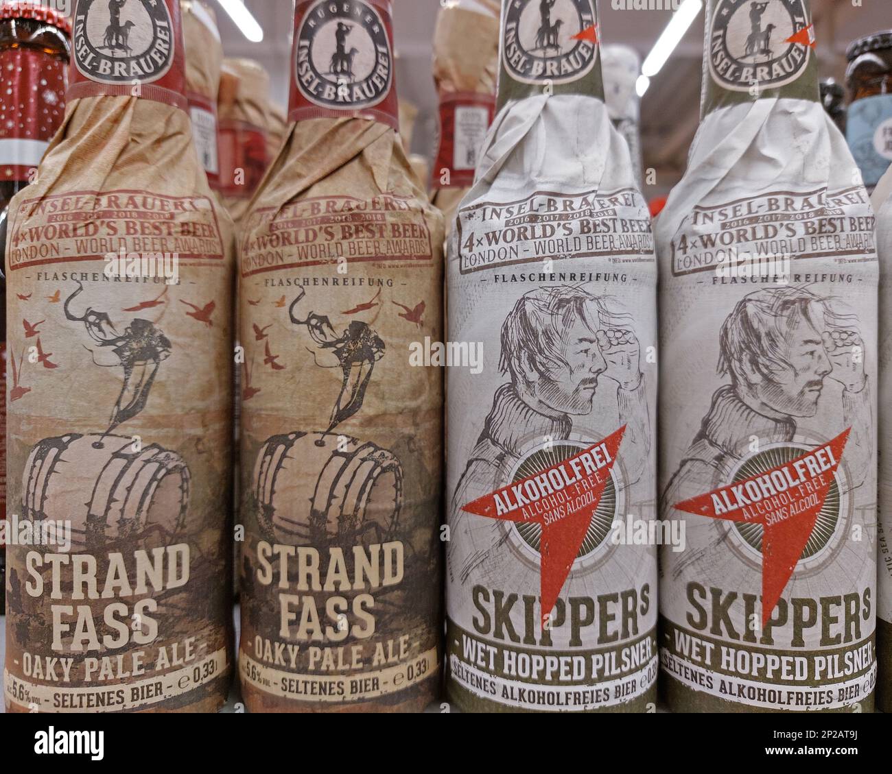 alcoholic Strand Barrel oaky pale ale and alcohol free Skippers pilsener beer bottles by Island Brewery in a supermarke Stock Photo