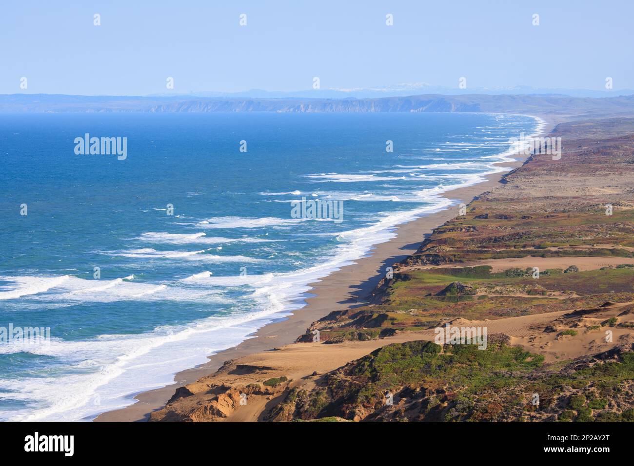 View of long sandy beach and cliffs of Point Reyes on Northern ...
