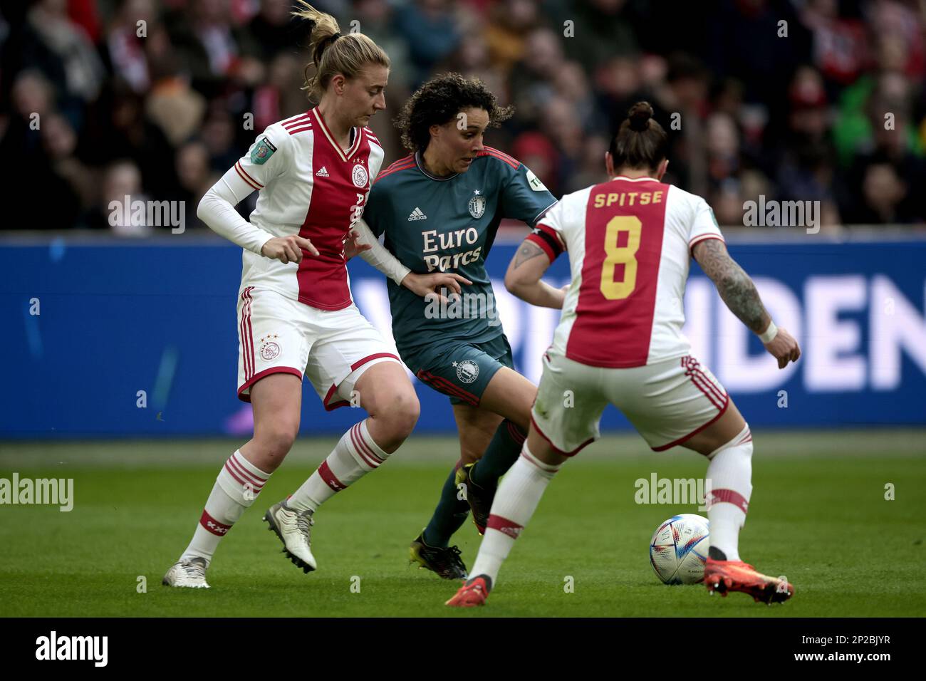 AMSTERDAM - (l-r) Lisa Doorn of Ajax women, Zoi van de Ven of Feyenoord V1, Sherida Spitse of Ajax women during the Dutch Eredivisie women's match between Ajax and Feyenoord at Johan Cruijff ArenA on March 4, 2023 in Amsterdam, Netherlands. ANP JEROEN PUTMANS Stock Photo