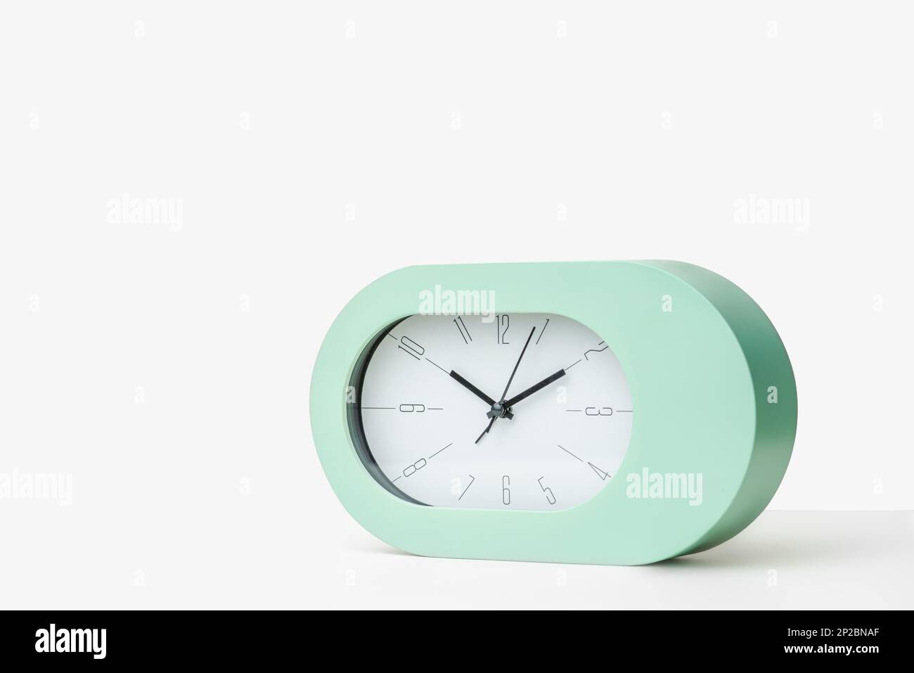 Contemporary clock modern alarm clock design white background studio