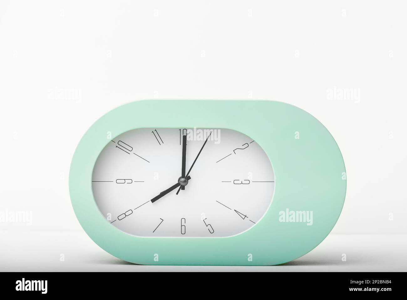 Contemporary clock modern alarm clock design white background studio