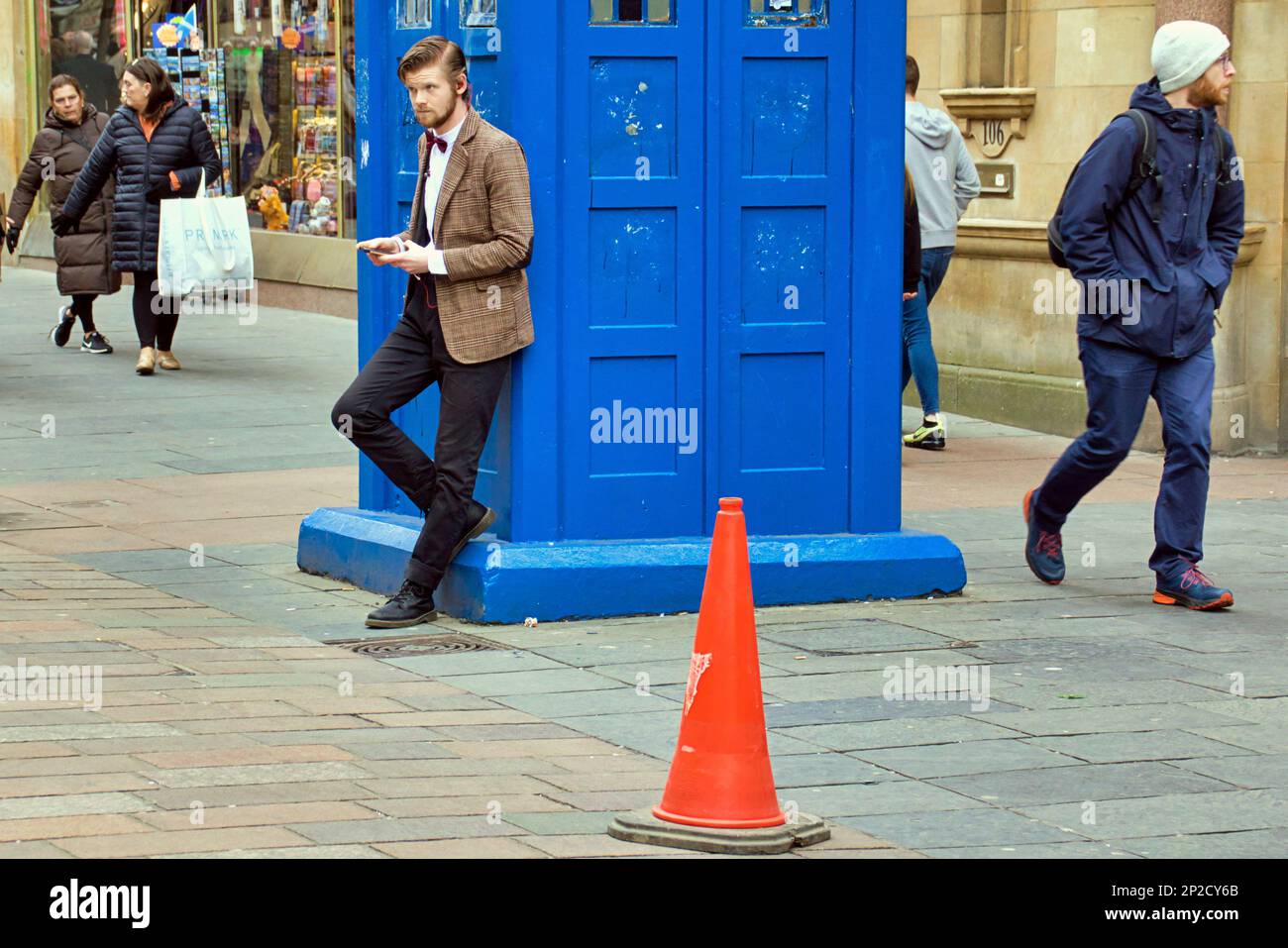 Glasgow, Scotland, UK 4th March, 2023. UK Weather:  Spring sunshine saw locals take to the streets in anticipation of summer. On the style mile of buchanan street scotland's shopping premier site, Comic con at the sec centre saw an aptly dressed matt smith dr who look a like beside the tardis phone box. Credit Gerard Ferry/Alamy Live News Stock Photo