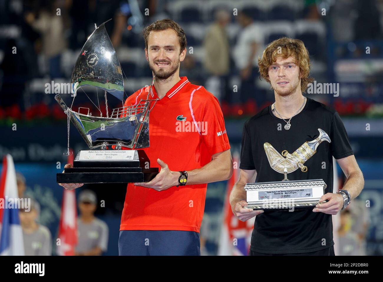 Dubai, UAE, 4th.March, 2023. Russian tennis players at the trophy  presentation, Winner Daniil Medvedev (red shirt) and runner-up Andrey  Rublev at the Dubai Duty Free Tennis Championships tournament at Dubai Duty  Free