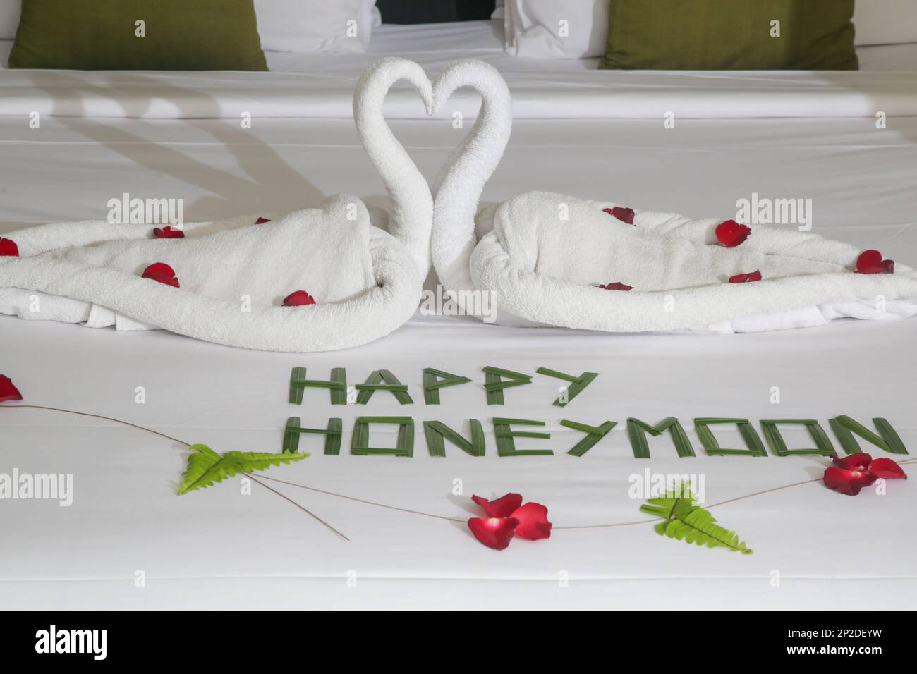 Luxury hotel bedroom interior with honeymoon decoration, Towel swans