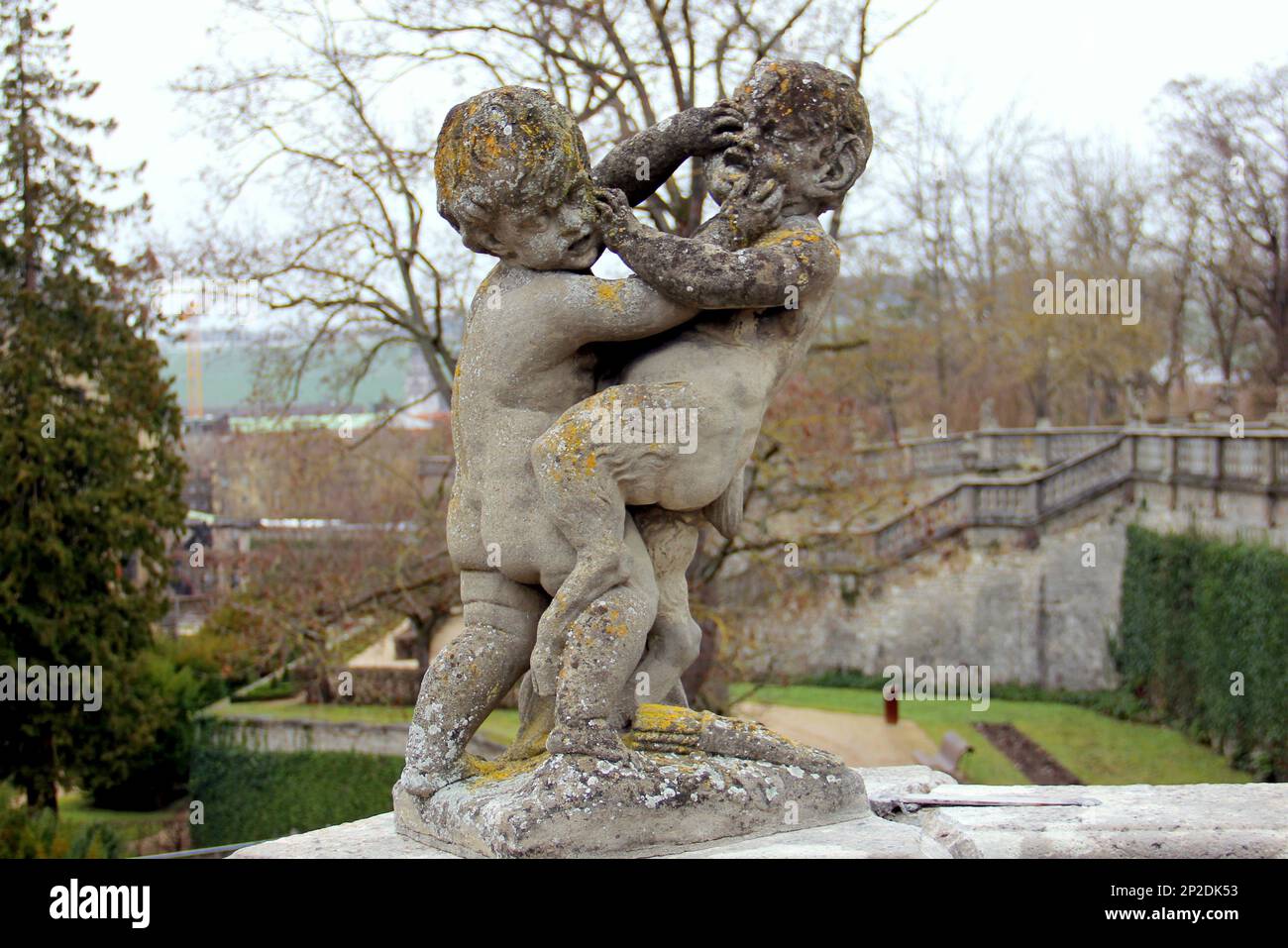 Sculpture of wrestling putti in the Court Gardens of the Residenz, 18th-century baroque Prince-Bishops Palace, Wurzburg, Germany Stock Photo