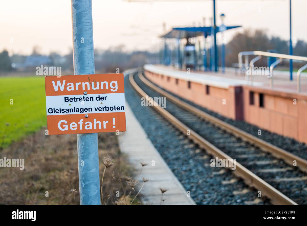 warning sign in front of a streetcar stop Stock Photo