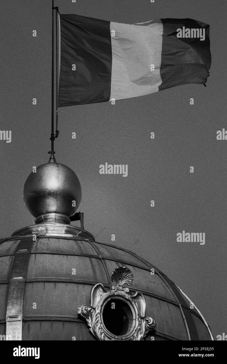 Archives 90ies G7 summit, French flag waves on top of the Townhall