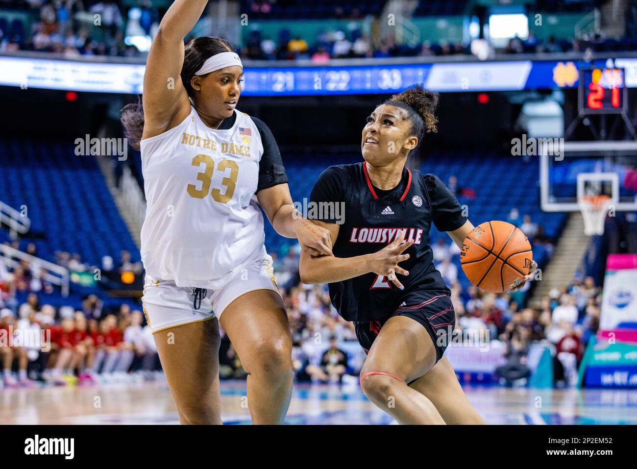 Greensboro, NC, USA. 4th Mar, 2023. Notre Dame Fighting Irish center Lauren Ebo (33) guards the drive from Louisville Cardinals forward Nyla Harris (2) during the semifinals of the Women's ACC Tournament at Greensboro Coliseum in Greensboro, NC. (Scott Kinser/Cal Sport Media). Credit: csm/Alamy Live News Stock Photo