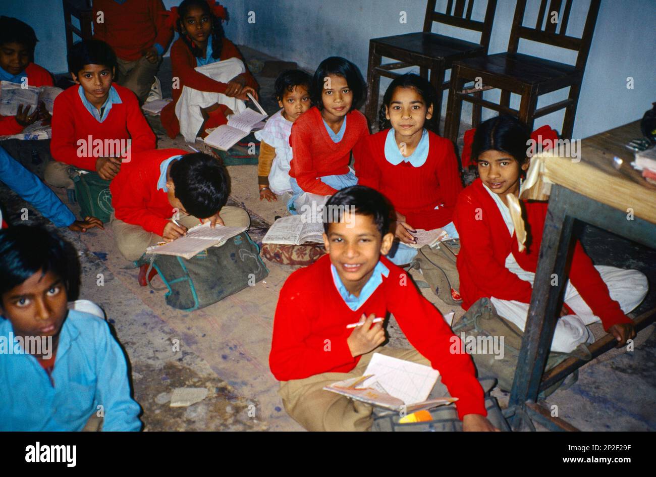 Rishikesh India School Children Sitting on Floor In Classroom Stock Photo