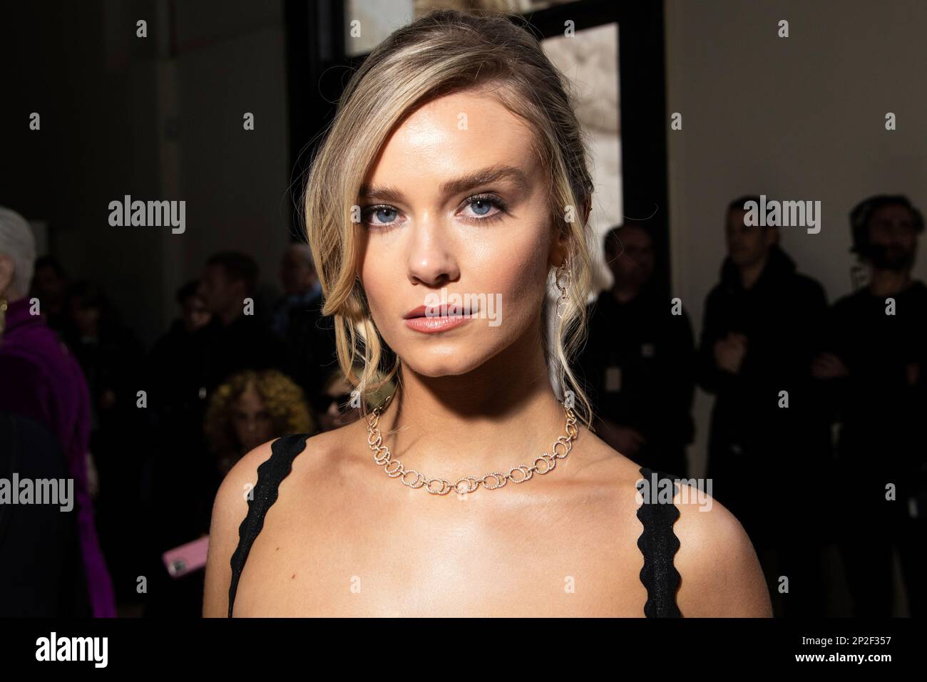 Leah McNamara poses for photographers at the Elie Saab Fall/Winter 2023