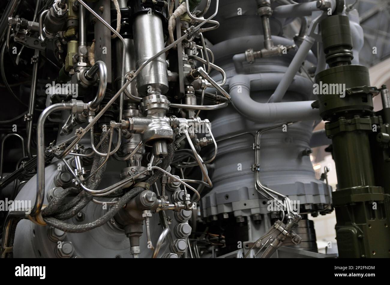 Elements of a rocket engine with several pipelines supplying fuel and coolant to the combustion