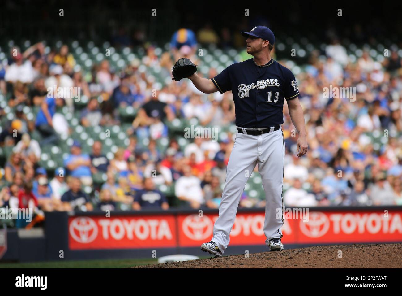 MILWAUKEE, WI - AUGUST 06: Milwaukee Brewer catcher Jonathan Lucroy signs  his retirement papers prior to a game between the Milwaukee Brewers and the  Cincinnati Reds at American Family Field on August