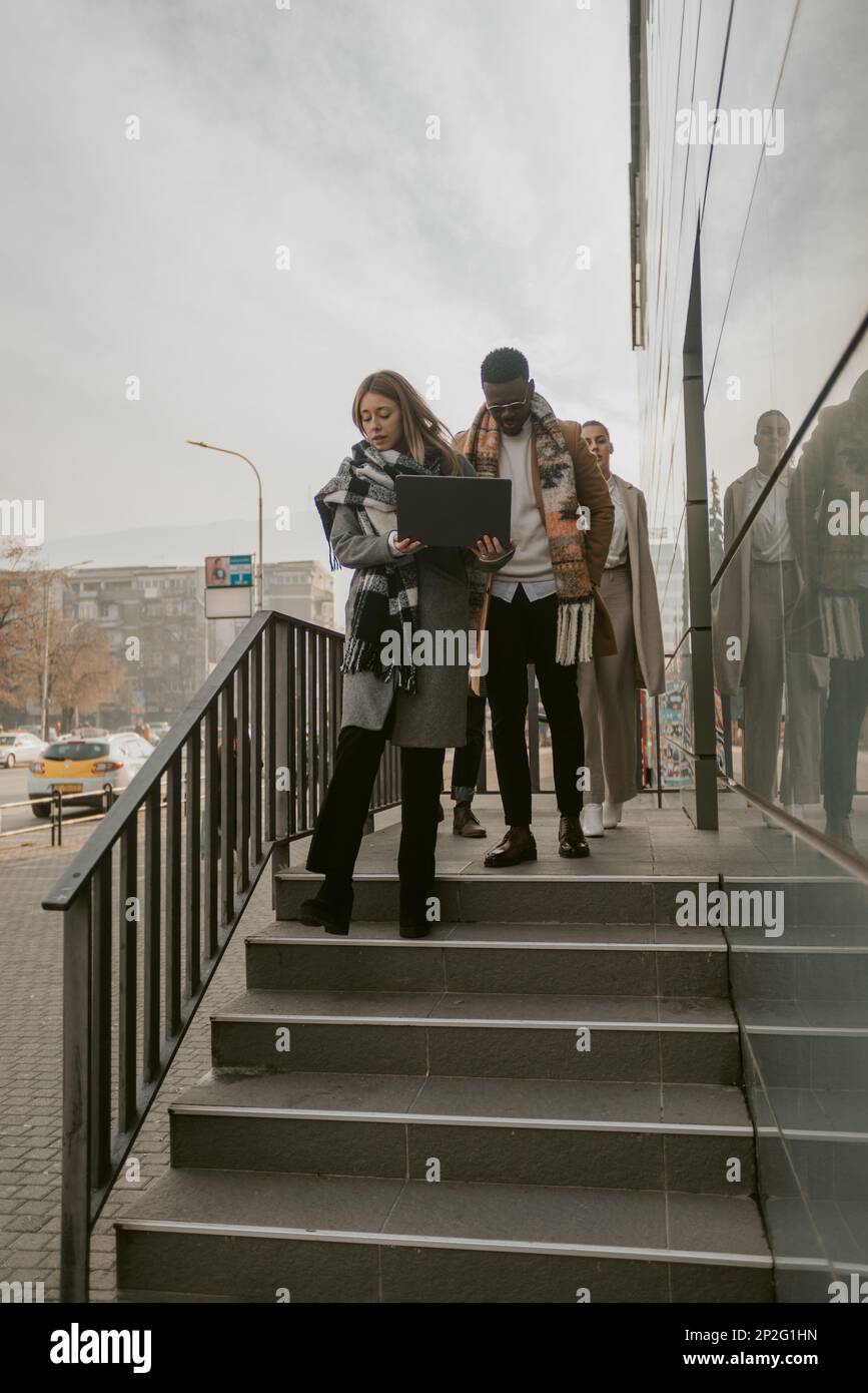 Businesswoman going down stairs hi-res stock photography and images - Alamy