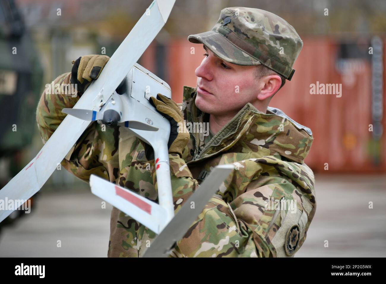 U.S. Army Spc. Charles Ivey with Palehorse Troop, 4th Squadron, 2nd Cavalry Regiment assembles an RQ-11 Raven, a Small Unmanned Aircraft System, ahead of a training exercise on Rose Barracks, Vilseck, Germany, Jan. 10, 2023. 2CR provides V Corps with a lethal and agile force capable of rapid deployment throughout the European theater in order to assure allies, deter adversaries, and when ordered, defend the NATO alliance. Stock Photo