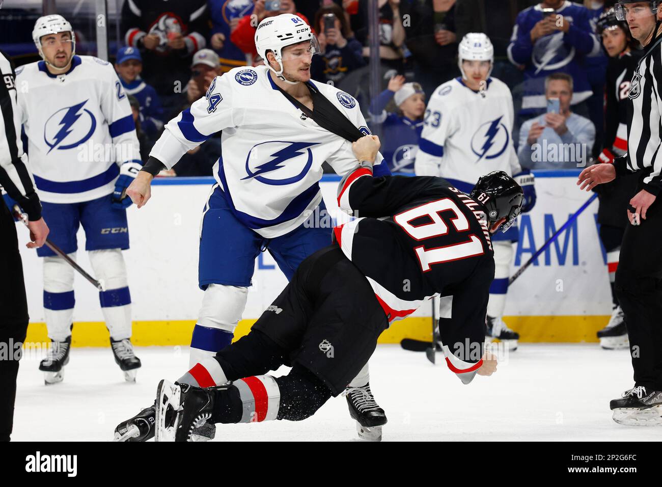 Tampa Bay Lightning left wing Tanner Jeannot (84) and Buffalo Sabres defenseman Riley Stillman