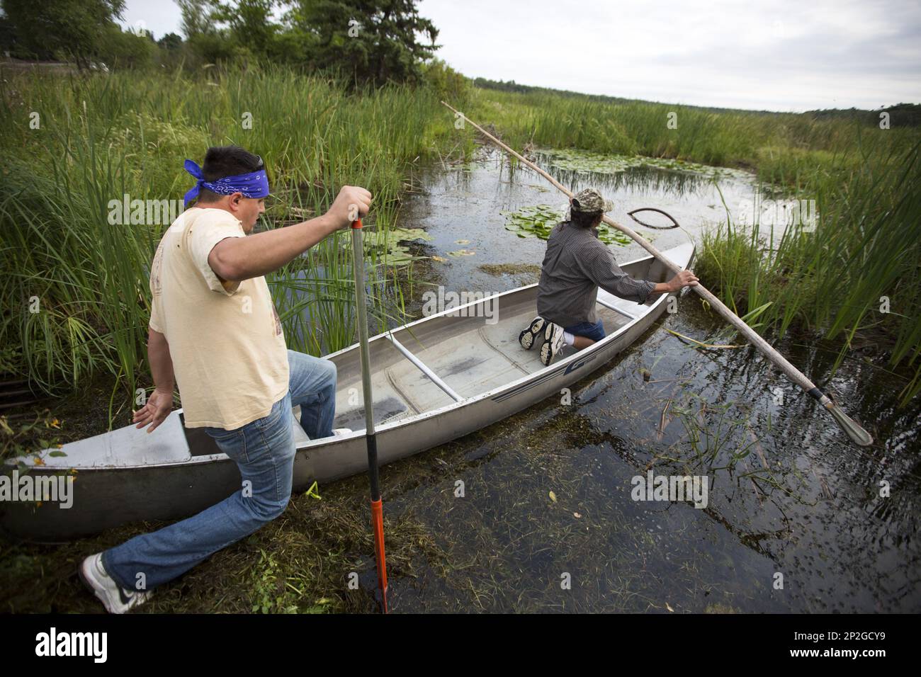 Todd Thompson and Terry Sr. launch their canoe to begin