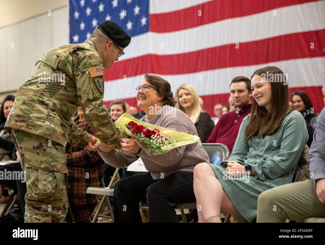 Indiana National Guard Capt. Michael Ratliff presents flowers to Deedra