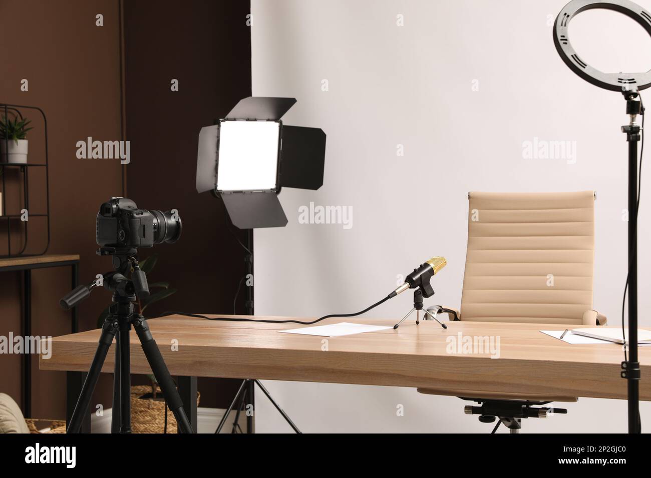 Modern blogger's workplace with professional equipment in room Stock ...