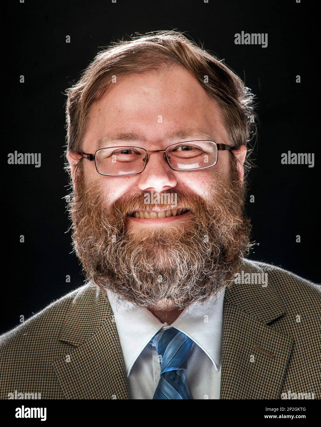 In this Aug. 21, 2015 photo, Chris Kaergard, a political reporter for the  Journal Star in Peoria, Ill., poses for a photo in Peoria, Ill. Kaergard  says he will not shave his