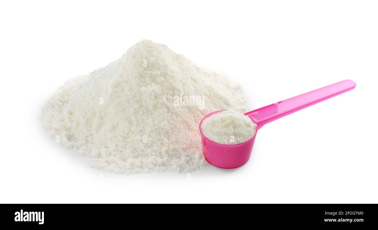 Powdered infant formula and scoop on white background. Baby milk Stock