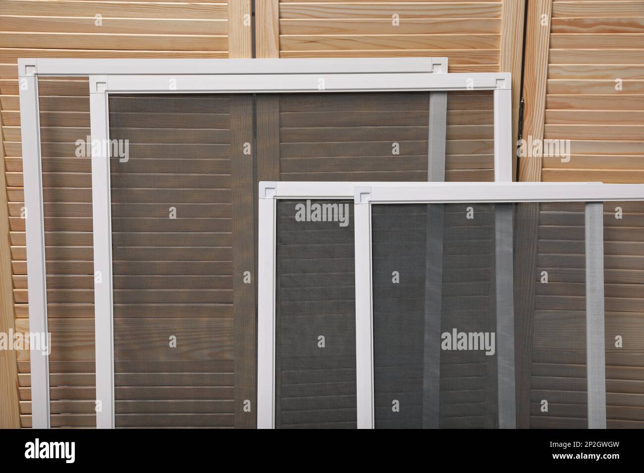 Set of window screens near wooden folding screen Stock Photo Alamy