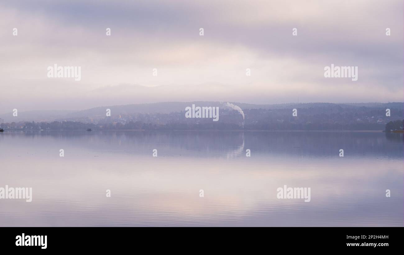 Calm reflection of woodland in lake aspen , jonsered, gothenburg, sweden Stock Photo