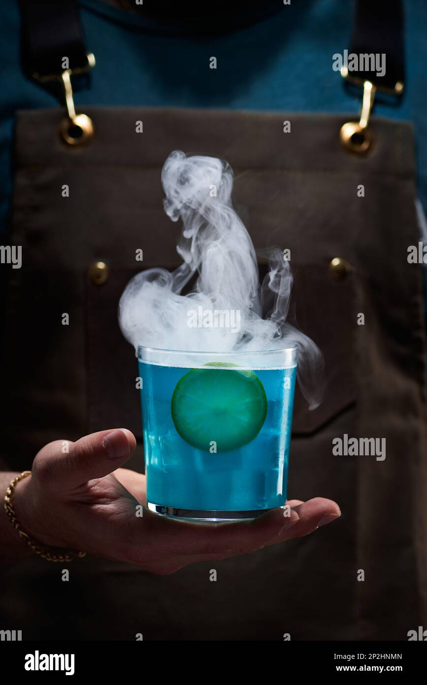 Special mixology cocktail, rum with curacao, blue color, lemon and ...