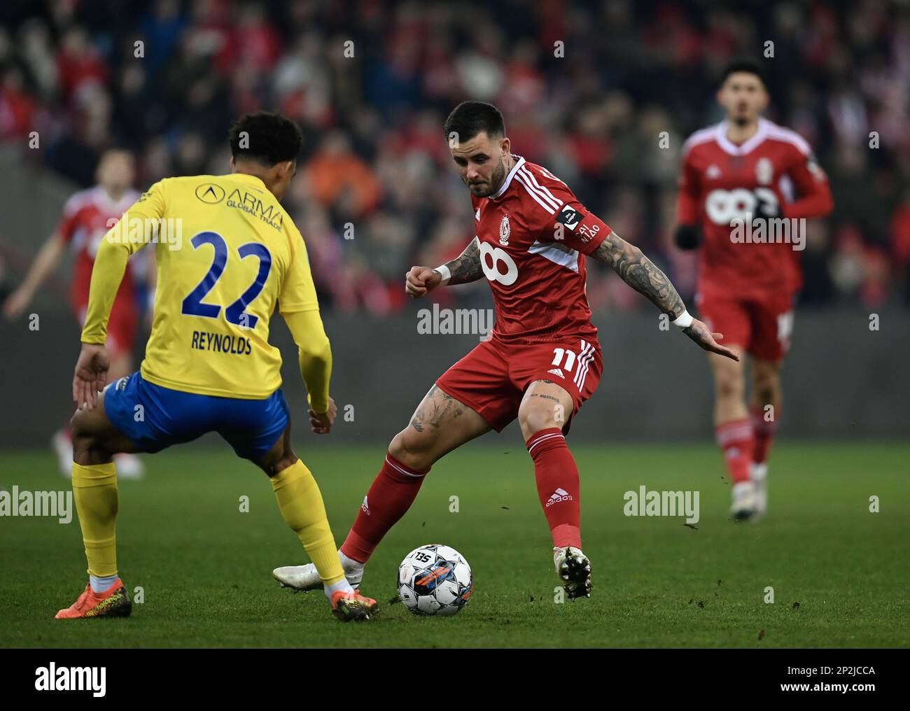Standard's Philip Zinckernagel and Westerlo's Bryan Reynolds fight for the  ball during a soccer match between Standard de Liege and KVC Westerlo,  Saturday 04 March 2023 in Liege, on day 28 of