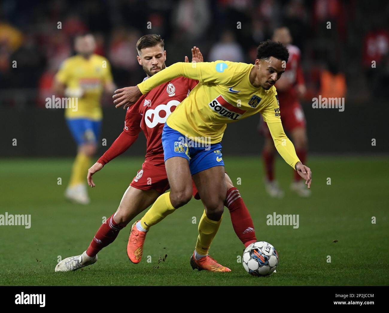 Standard's Philip Zinckernagel and Westerlo's Bryan Reynolds fight for the  ball during a soccer match between Standard de Liege and KVC Westerlo,  Saturday 04 March 2023 in Liege, on day 28 of