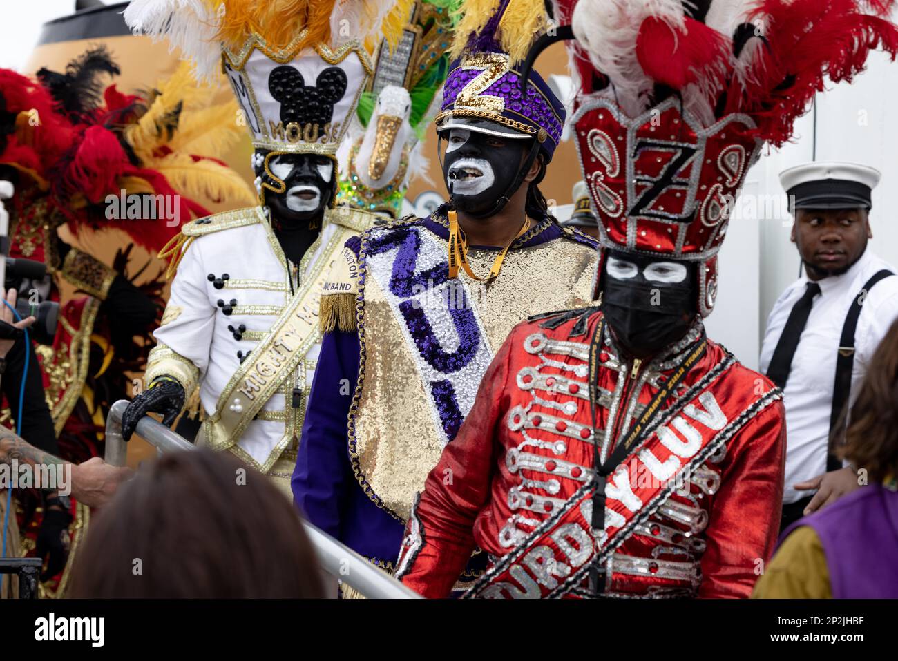 Tramps of Zulu members disembark the USCGC Pamlico (WLIC–800) in downtown New Orleans, Feb. 20, 2023. It is a Lundi Gras tradition for King Rex and King Zulu to arrive by ship to the riverfront to ring in festivities before their respective parades on Mardi Gras Day. Stock Photo