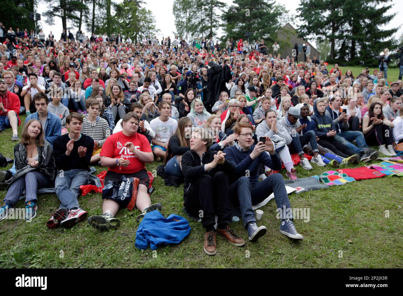 People gather at the opening of the summer camp on Utoya Island, Norway