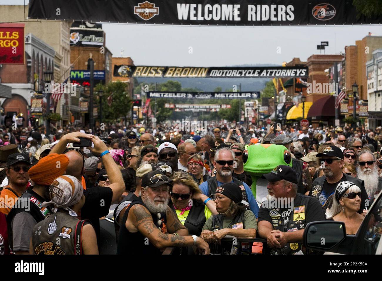 In this photo taken Tuesday, Aug. 4, 2015, hundreds of people gather