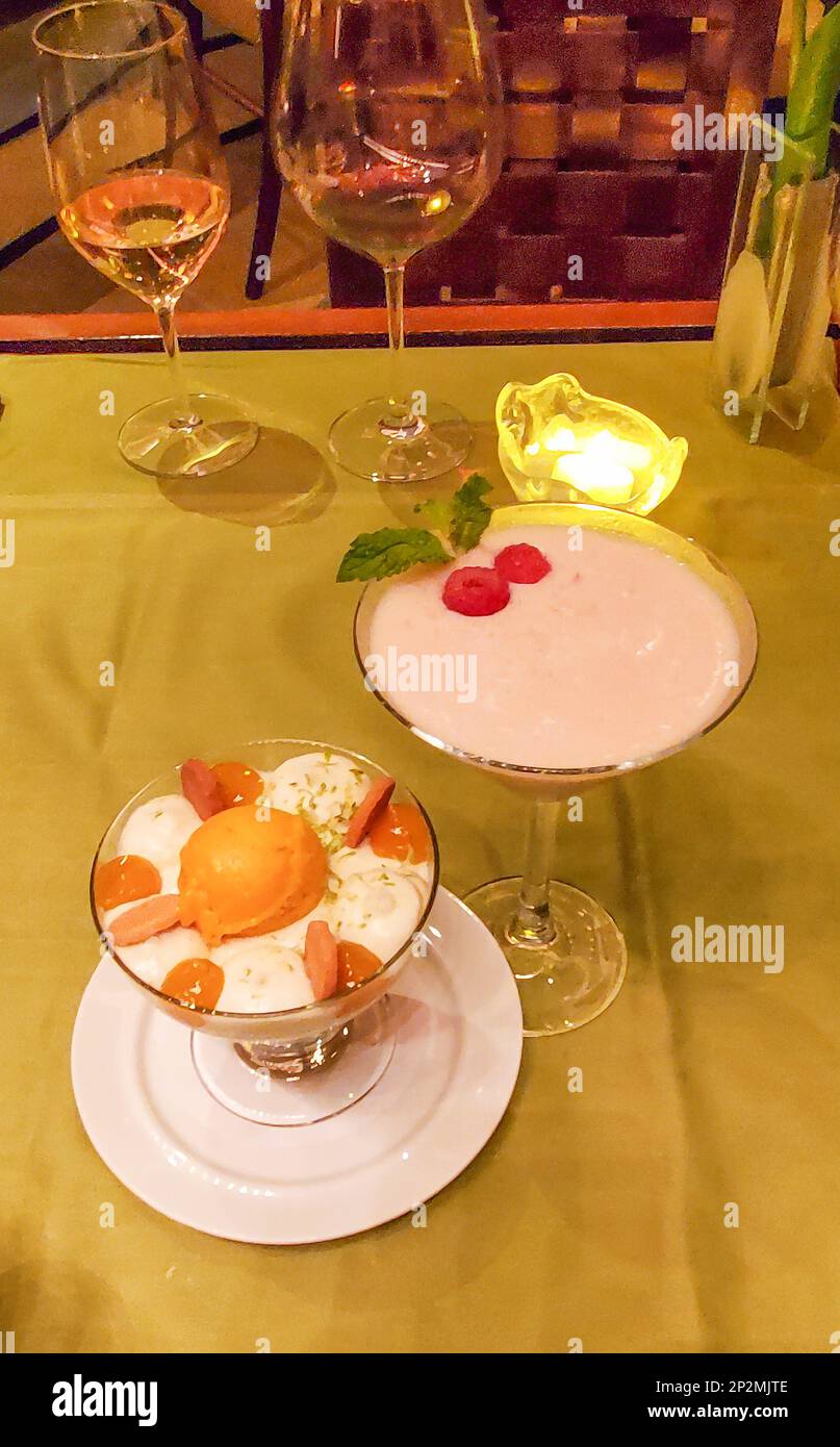 Fancy creamy sweet drink and accompanying cream and fruit dessert. Stock Photo