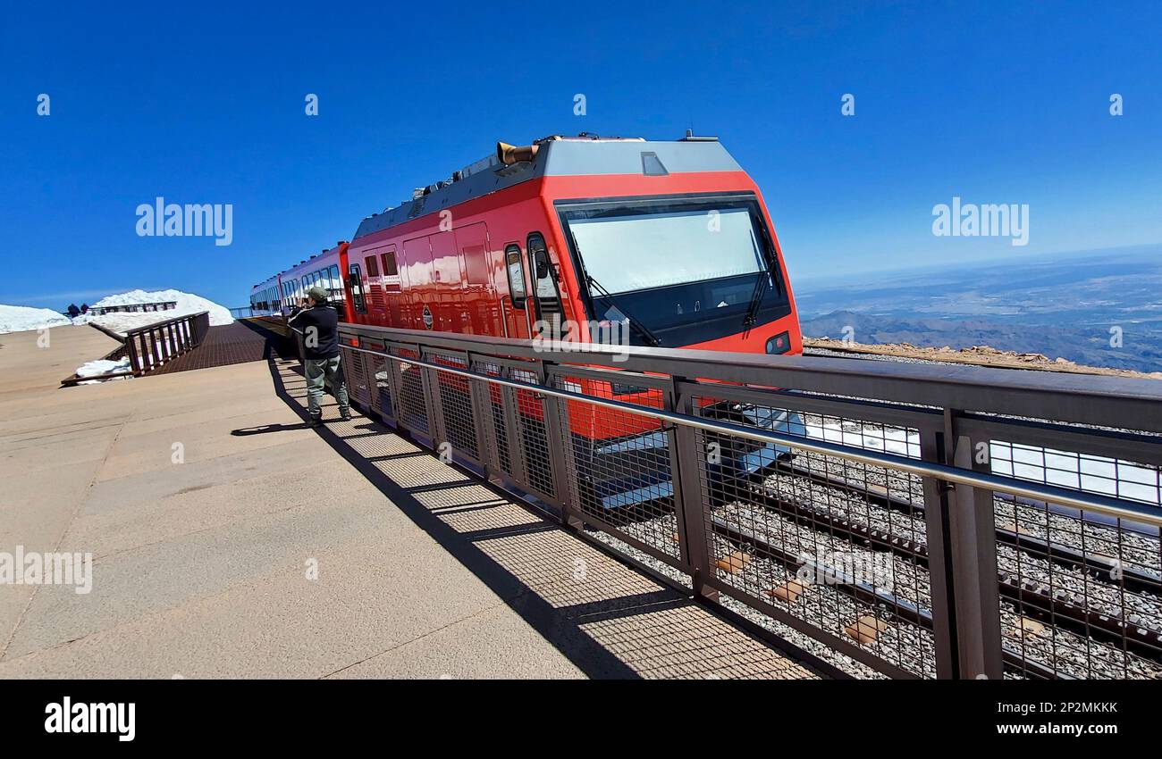 Tram waits for passengers on cog railway. Top of Pikes Peak, Colo. USA