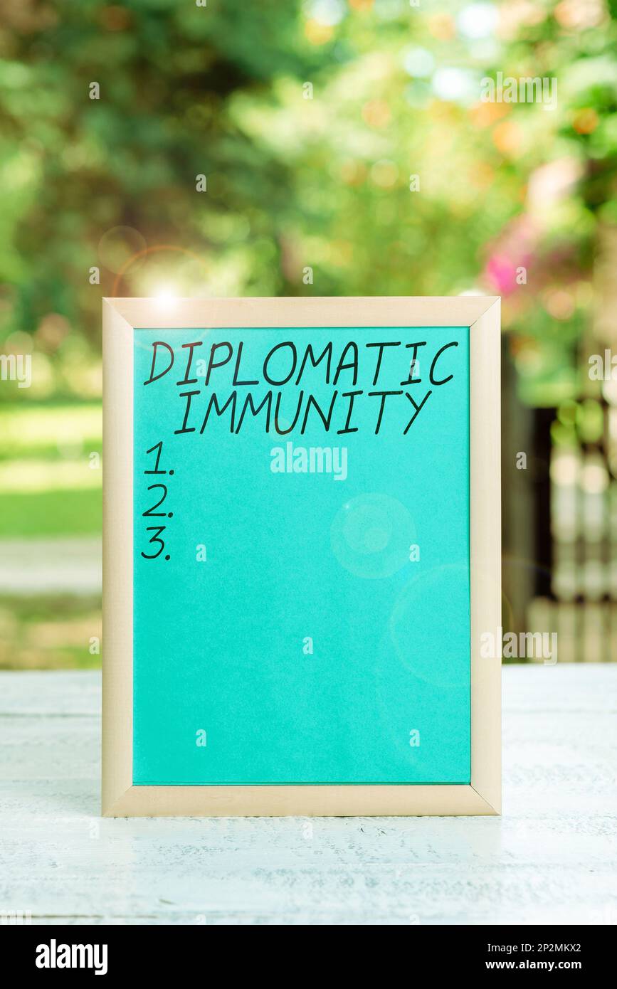 Sign displaying Diplomatic Immunity. Concept meaning law that gives