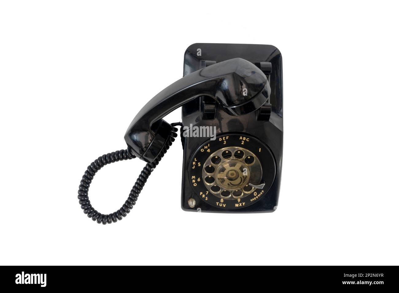 Old vintage black used telephone for use in home an isolated on white background Stock Photo