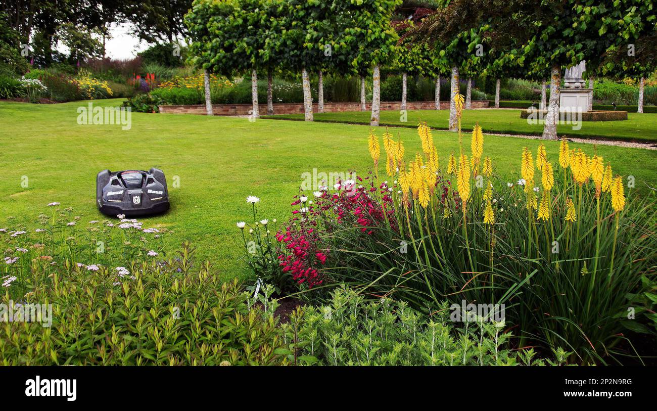 Robot lawnmower in Brightwater Gardens Stock Photo