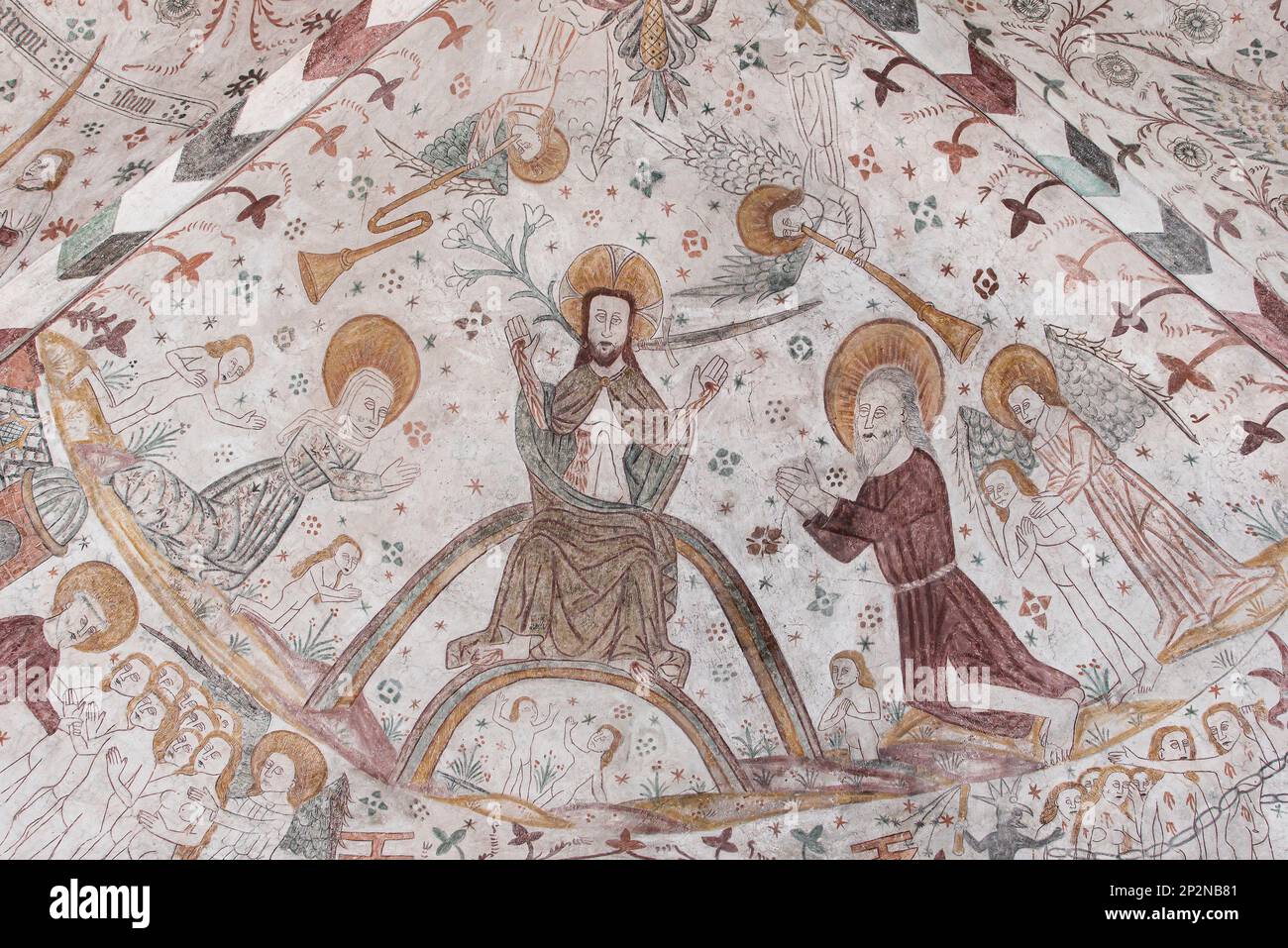 on the judgment day Christ stits on the rainbow, an 500 years old mural in Keldby Church, Denmark, October 10, 2022 Stock Photo