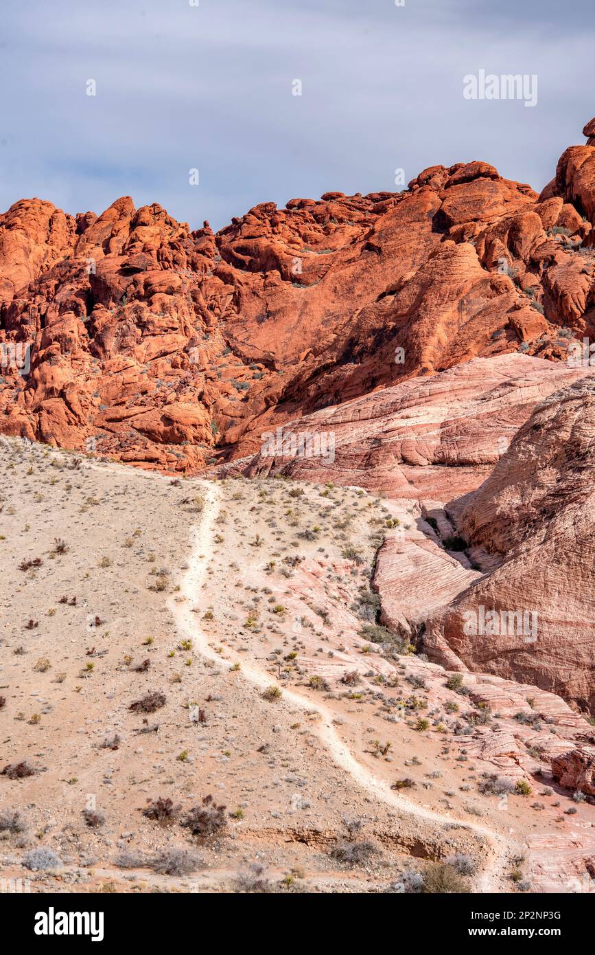 Steep hiking trail leading into the rugged wilderness of Red Rock Canyon in Las Vegas, Nevada provides access to leisure hikers and those who wish to Stock Photo