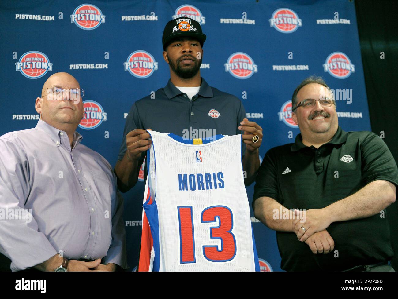 New Detroit Piston Marcus Morris, holds his new jersey with Pistons