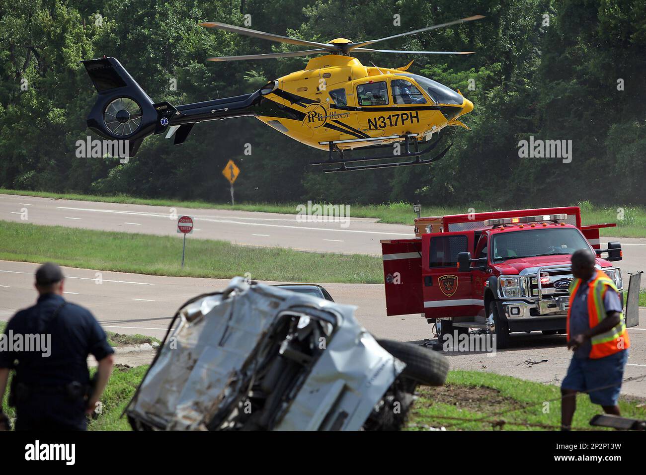 A woman who was trapped inside her car is flown to University of ...