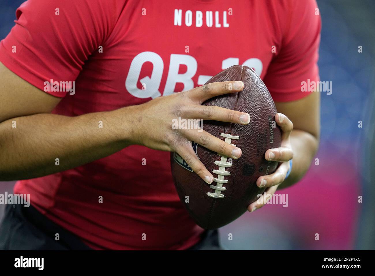 Ohio State quarterback CJ Stroud holds a football during a drill at the