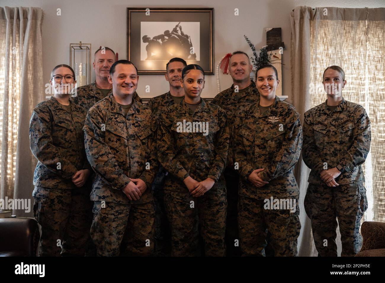 U.S. Marines and Sailors with 2nd Marine Logistics Group pose for a