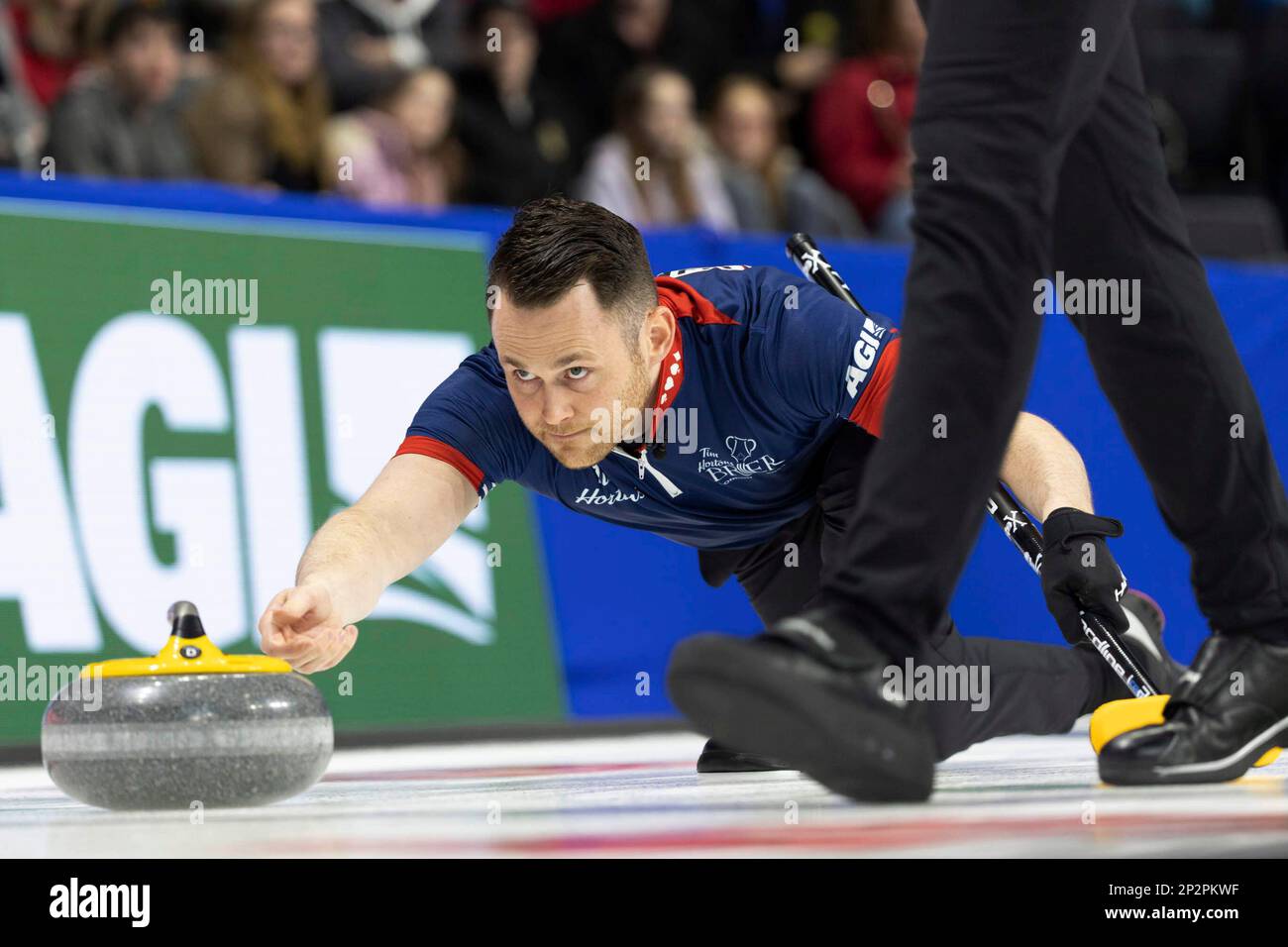 Wild Card second Connor Njegovan makes a shot against Northern Ontario during the Tim Hortons Brier curling event Saturday, March 4, 2023, in London, Ontario