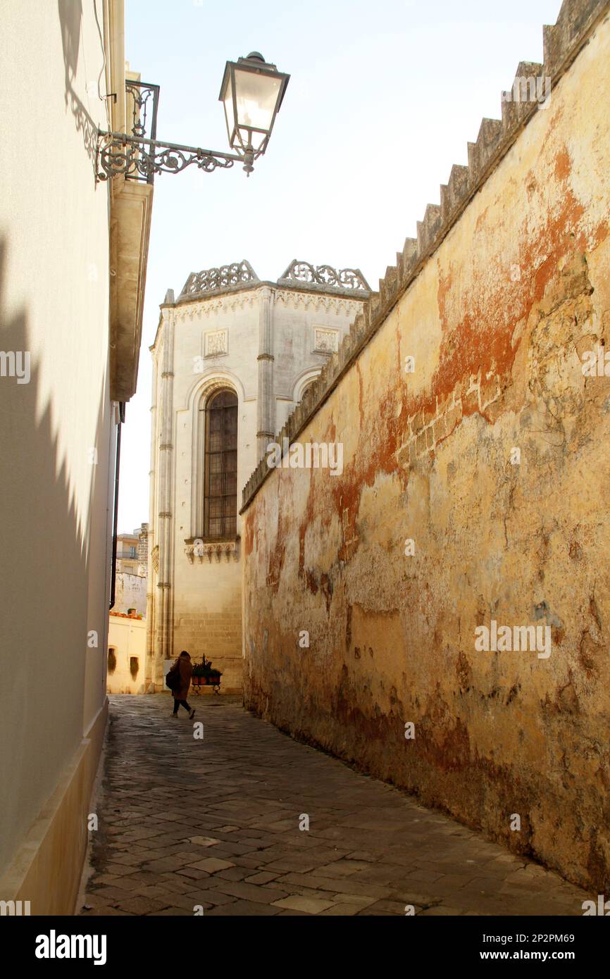 Galatina, Italy. Narrow alleyway along Basilica di Santa Caterina d'Alessandria. Stock Photo