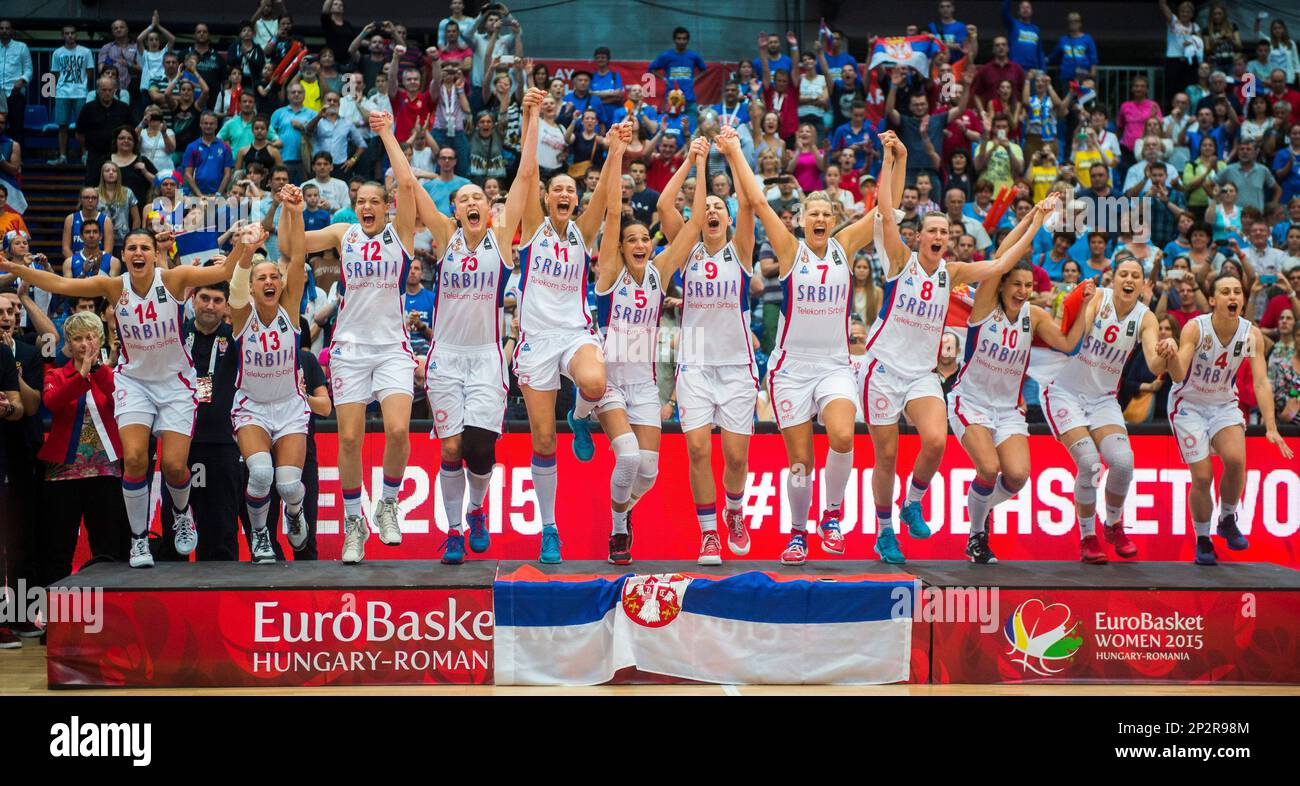 Players of Serbia celebrate on the podium after they defeated France