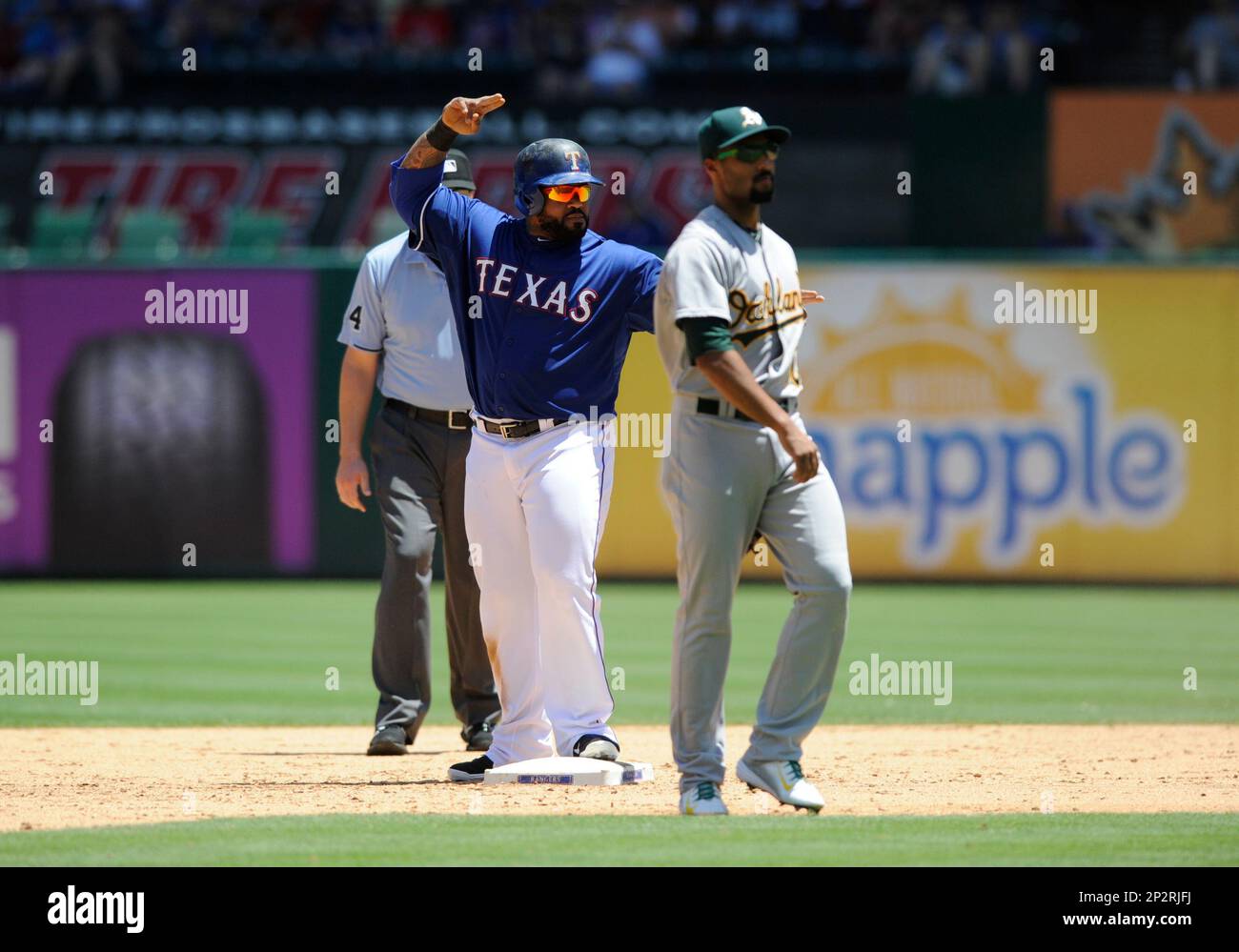 Texas Rangers designated hitter Prince Fielder, right, celebrates hit  two-run home run with teammate Adr…